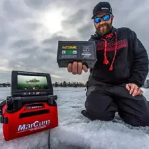 Ice fisherman using a fish finder on a frozen lake, North Sport Rentals in Minnesota