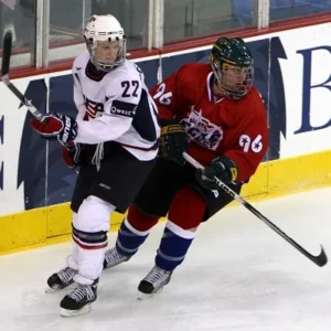 Two ice hockey players battling for the puck during a game in Minnesota