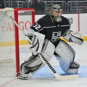 Ice hockey goalie standing ready in front of the net in Minnesota