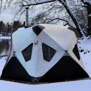 Portable sauna set up near an ice fishing site in Minnesota, offering warmth and comfort