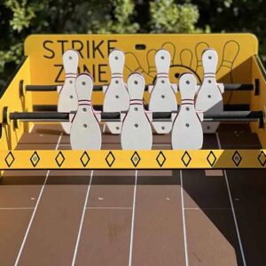 Tabletop and carnival games set up on grass at a summer camp activity day