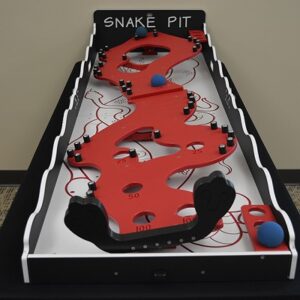 Tabletop and carnival games set up for a holiday party in a decorated indoor venue
