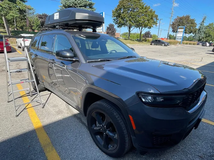 Rooftop Thule cargo box installed on vehicle for travel