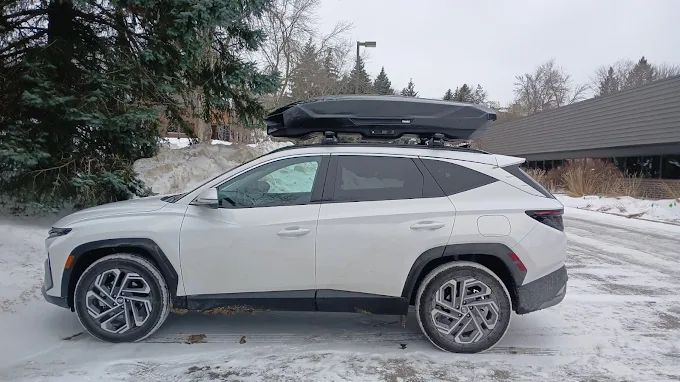 Thule cargo box installed on vehicle roof for rental