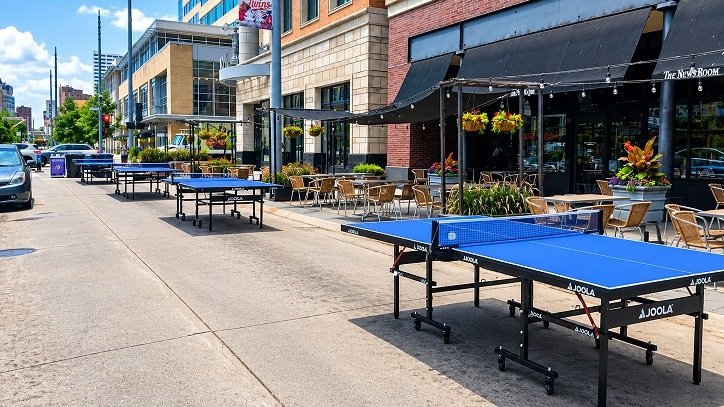 Four ping pong tables set up for the Downtown Wednesdays event near Nicollet Mall in downtown Minneapolis.